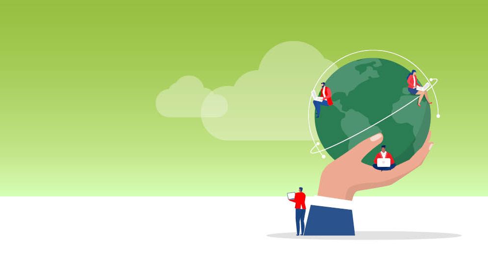 Picture of hand holding a globe and people working around it